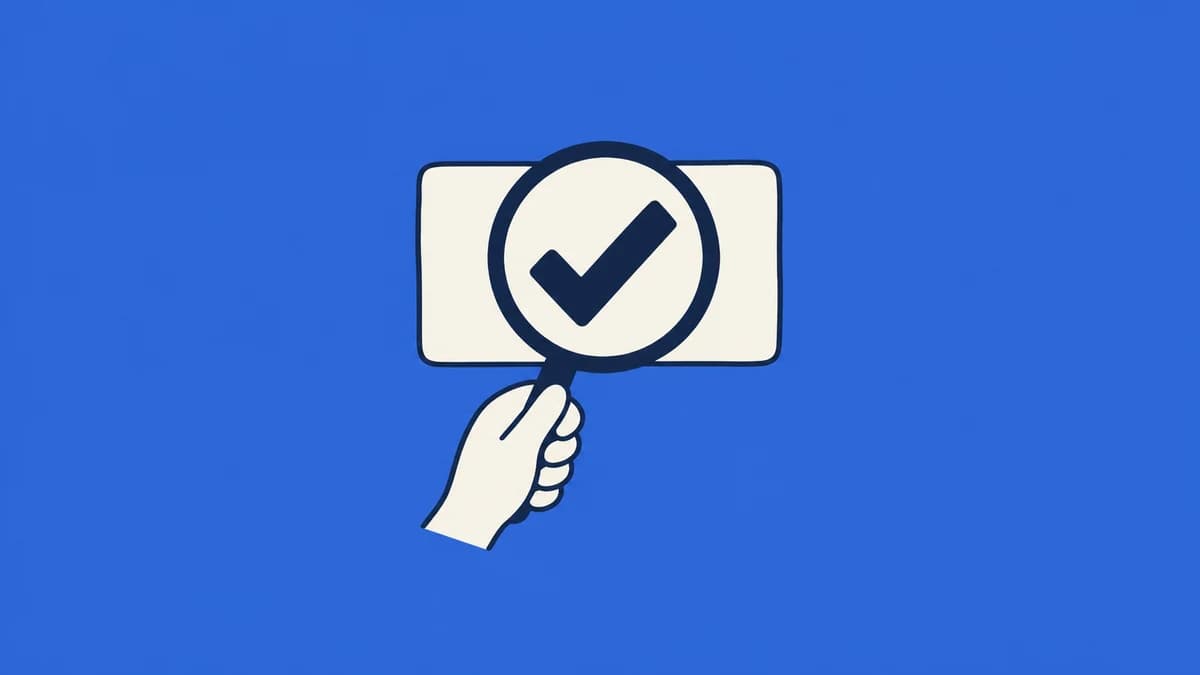 A hand holding a magnifying glass over a service card with a check mark.