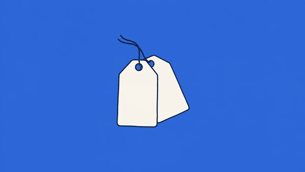 Overlapping blank price tags on a blue background.